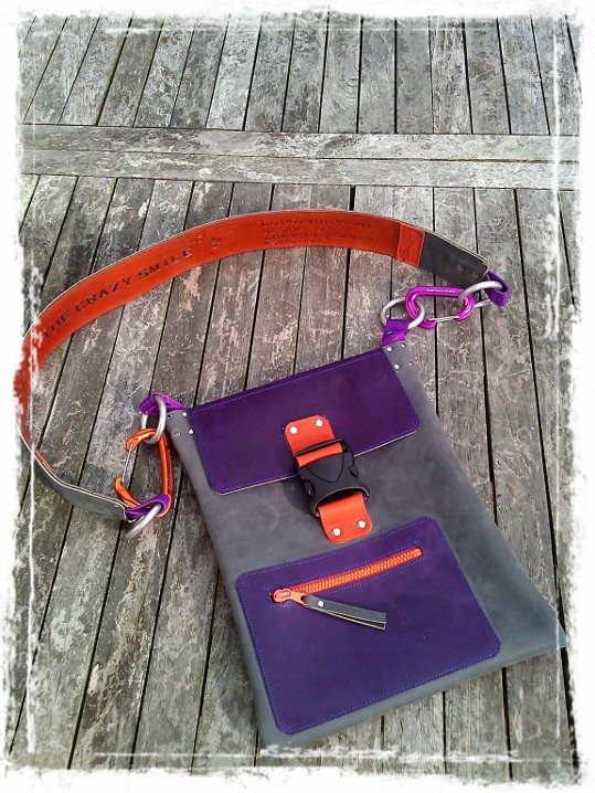 Handmade Leather Bag with TheCrazySmile and Quote on shoulder trap