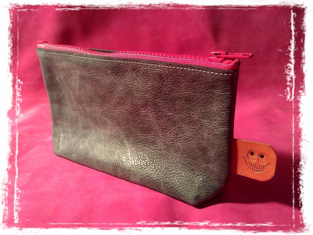 shades of grey with pink zipper a smile