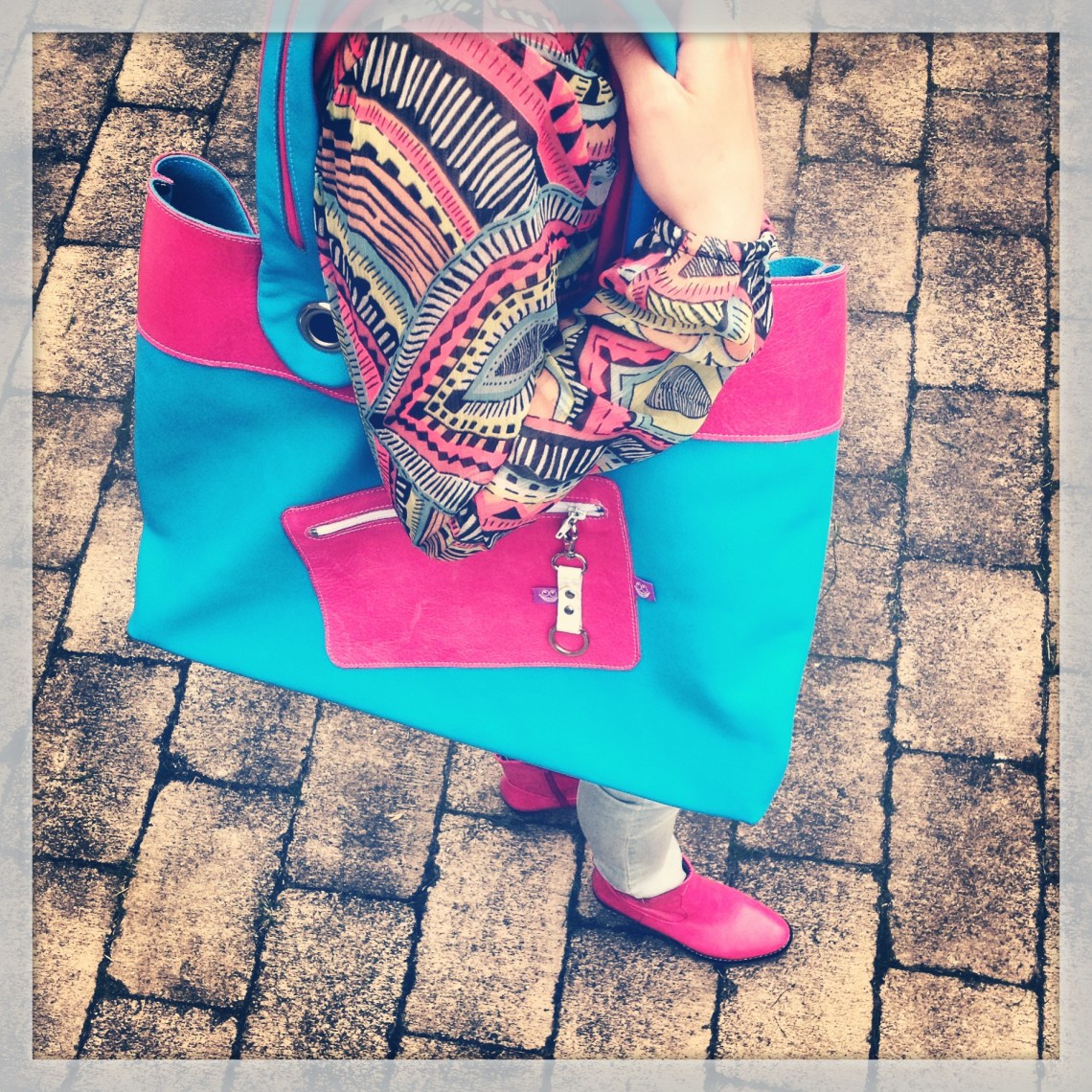 Pink and Blue leather bag in action