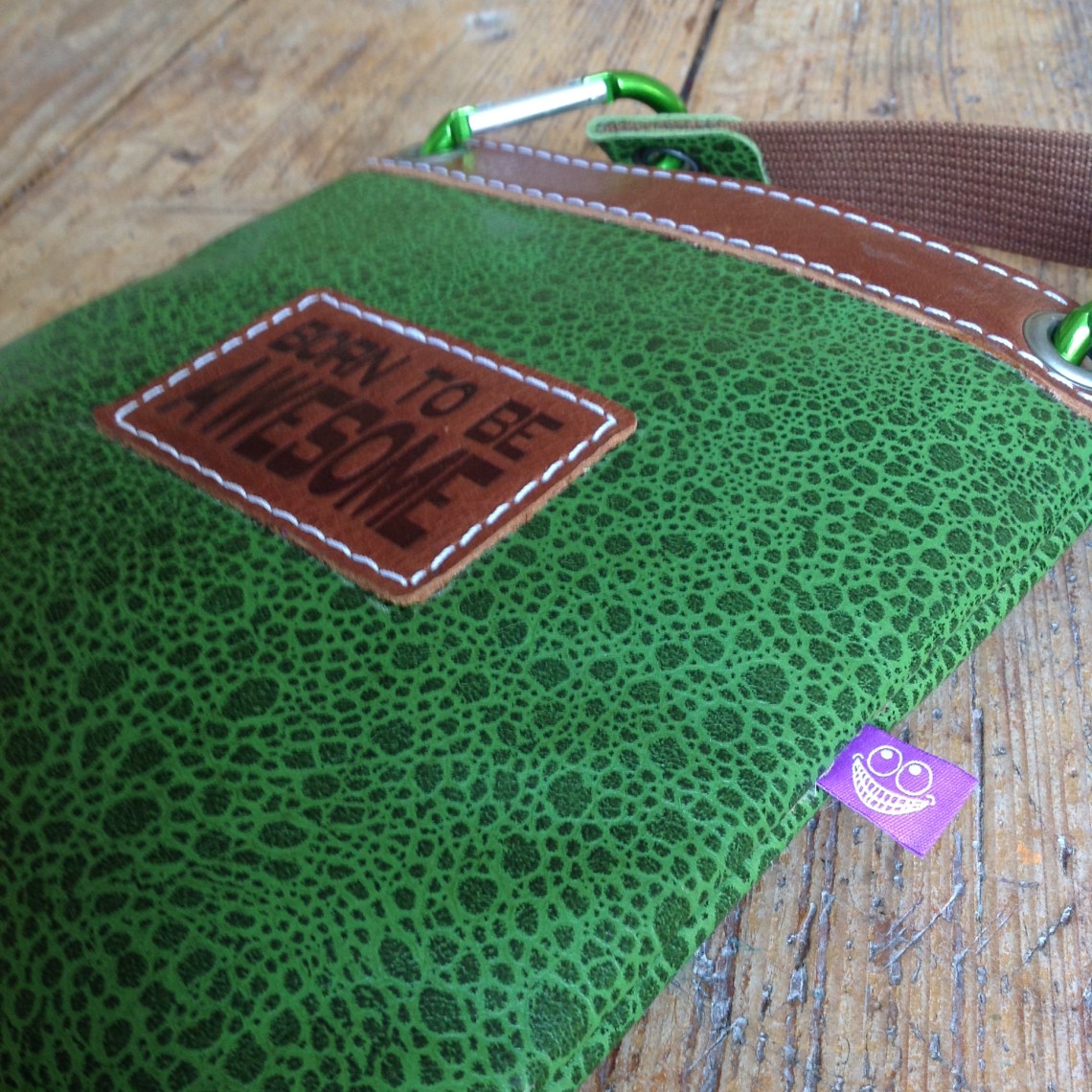 close up green leather bag